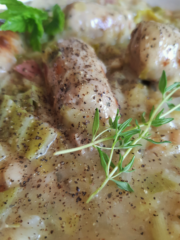 Close up of this seasonal sensation showing thyme, sausage and sauce.
